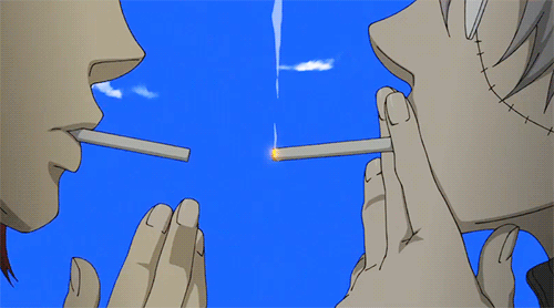 gif of spirit albarn and franken stein from Soul Eater; they stand before a blue sky of clouds (inside death's room) sharing an indirect kiss as spirit lights his cigarette with stein's.